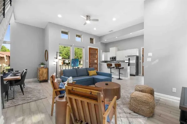 a living room with furniture and a large window