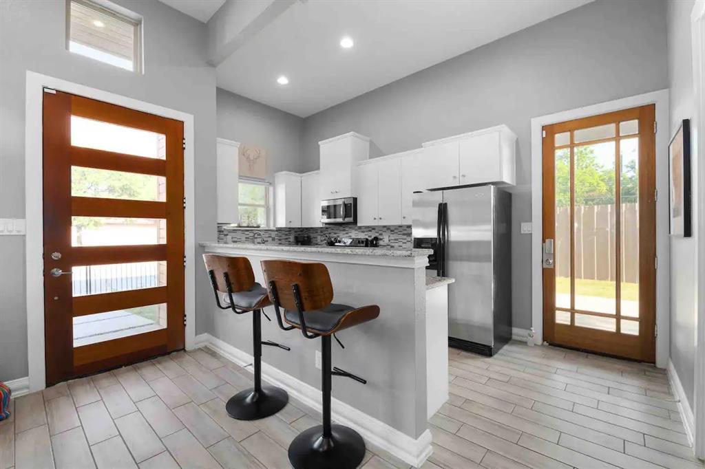 3807 Vilbig Road Dallas, TX 75212 - Photo 9 of 40 a kitchen with stainless steel appliances granite countertop a refrigerator and a sink