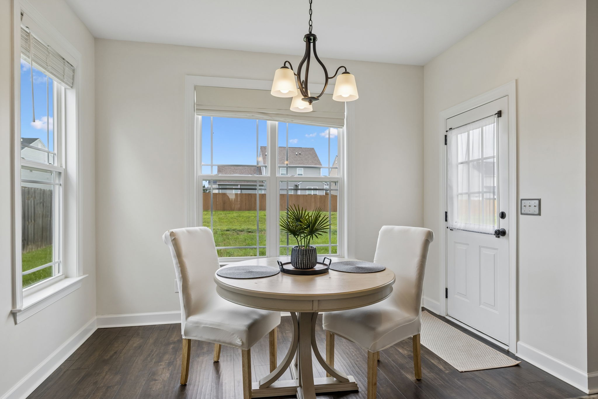1002 Garrison Way Spring Hill, TN 37174 - Photo 30 of 63 a view of a dining room with furniture window and wooden floor