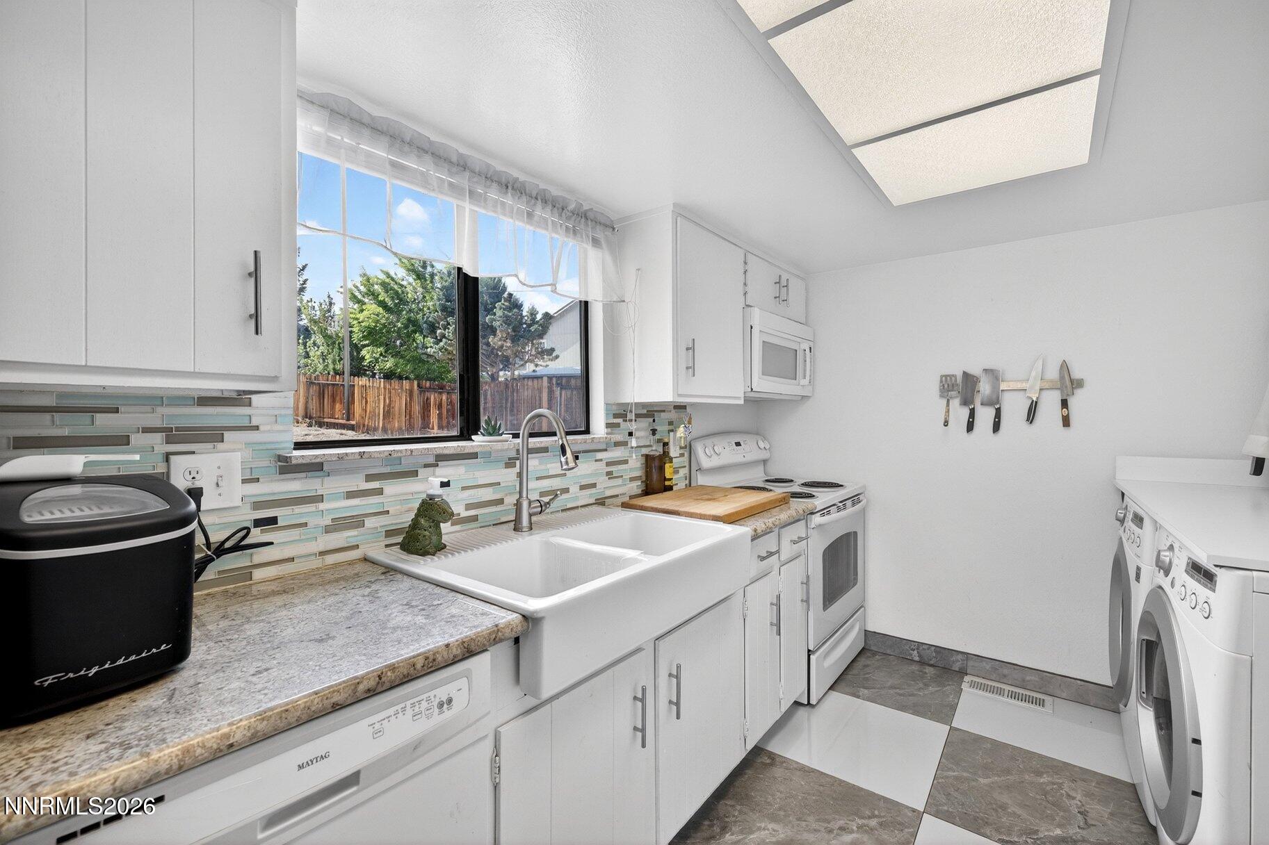 3415 Balboa Drive Reno, NV 89503 - Photo 8 of 61 a kitchen with a sink stove and cabinets