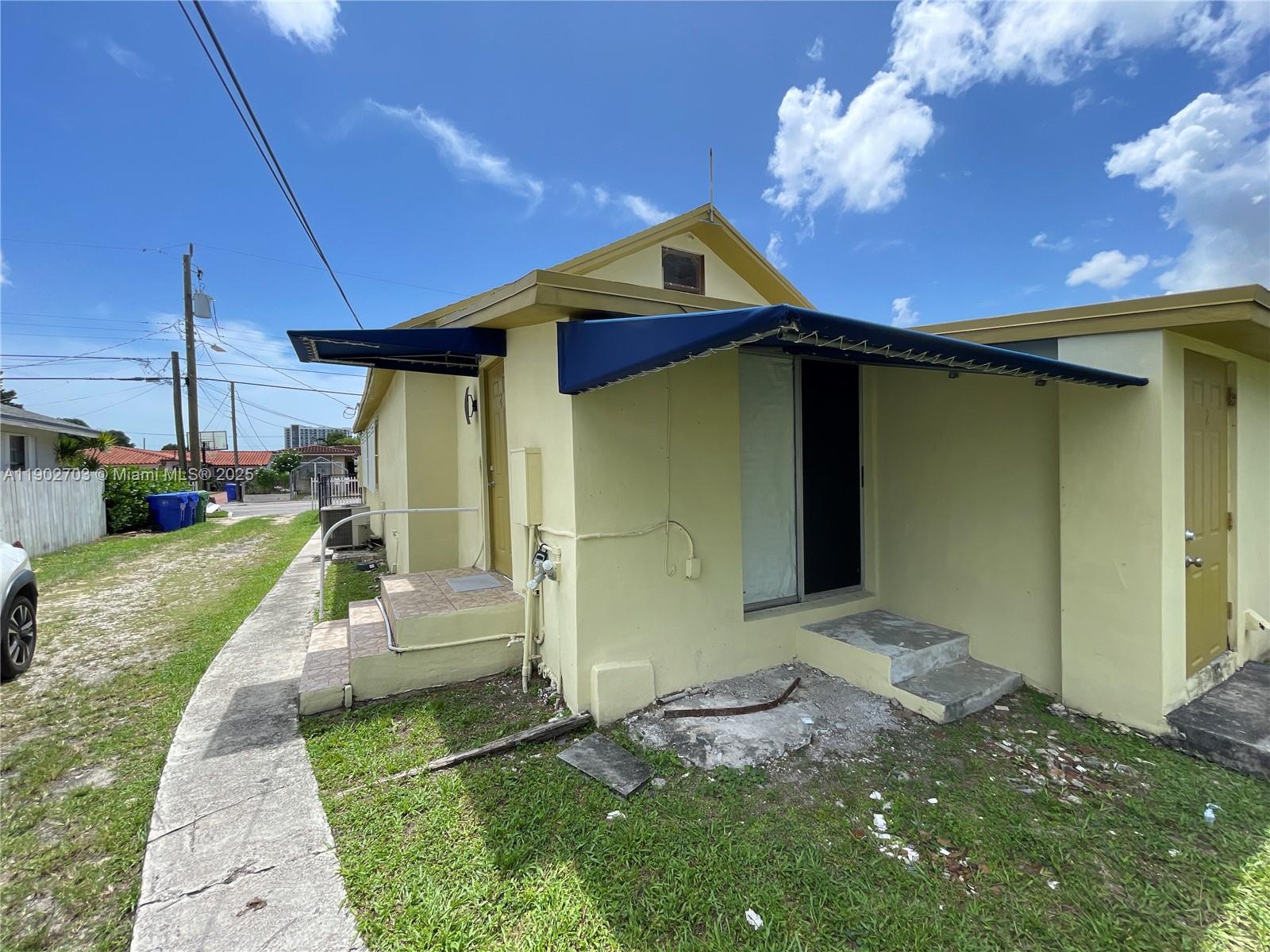 3157 Southwest 17th Street, Unit B Miami, FL 33145 - Photo 11 of 18 a front view of a house with a yard