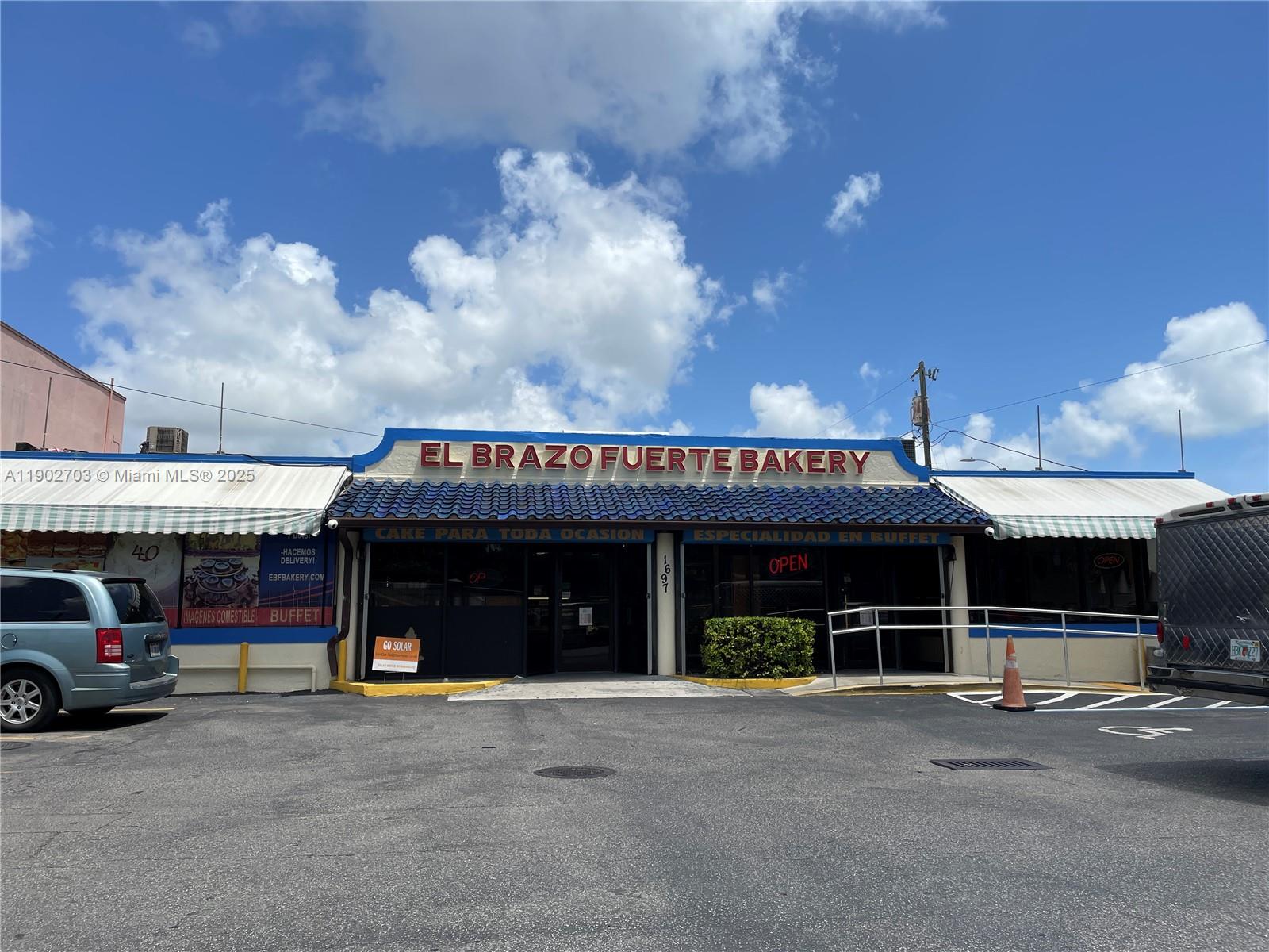 3157 Southwest 17th Street, Unit B Miami, FL 33145 - Photo 16 of 18 a front view of a building with retail shop and a fireplace
