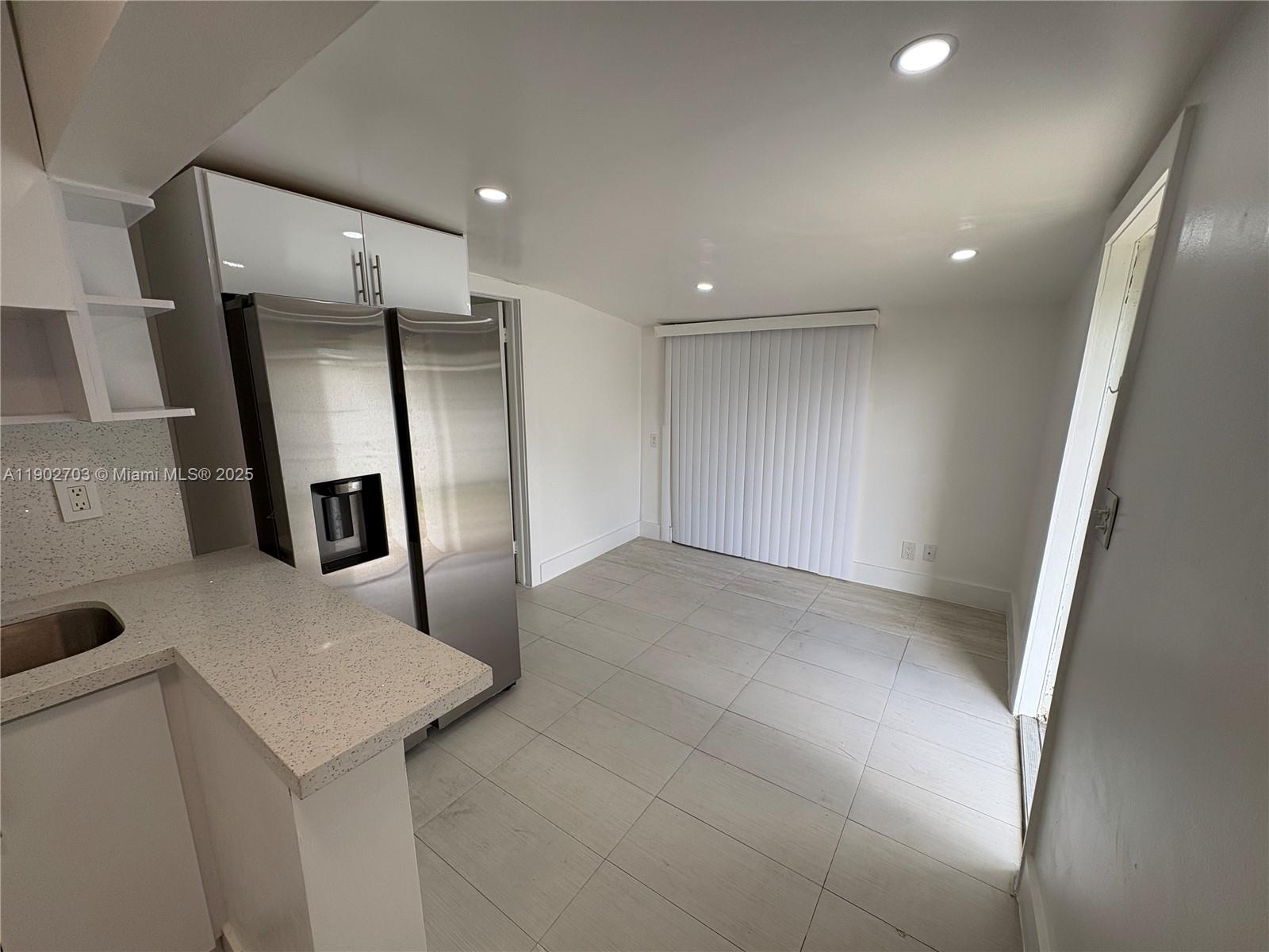 3157 Southwest 17th Street, Unit B Miami, FL 33145 - Photo 4 of 18 a view of a hallway with seating area