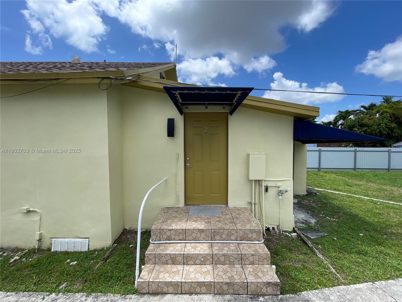 3157 Southwest 17th Street, Unit B Miami, FL 33145 - Photo 10 of 18 a front view of a house with a yard