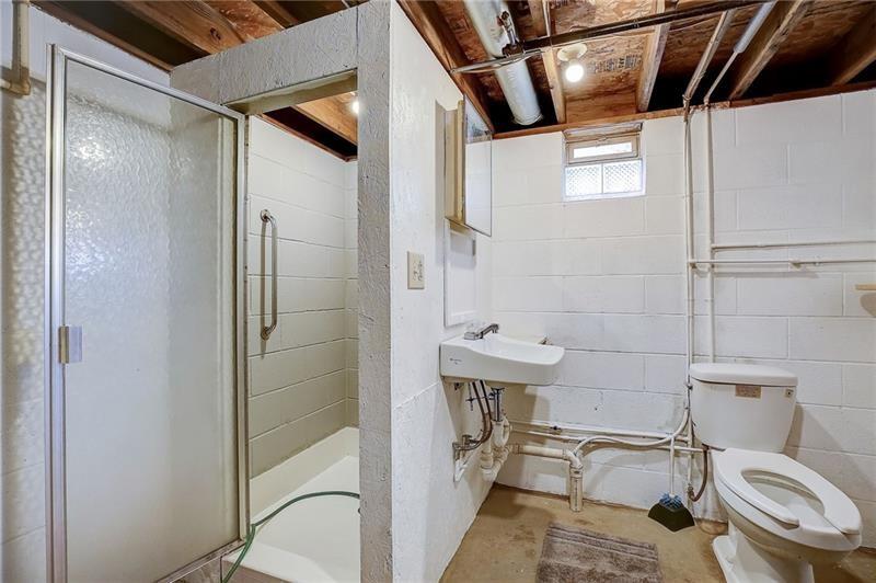 952 Seybertown Road East Brady, PA 16028 - Photo 24 of 46 a bathroom with a sink toilet and shower