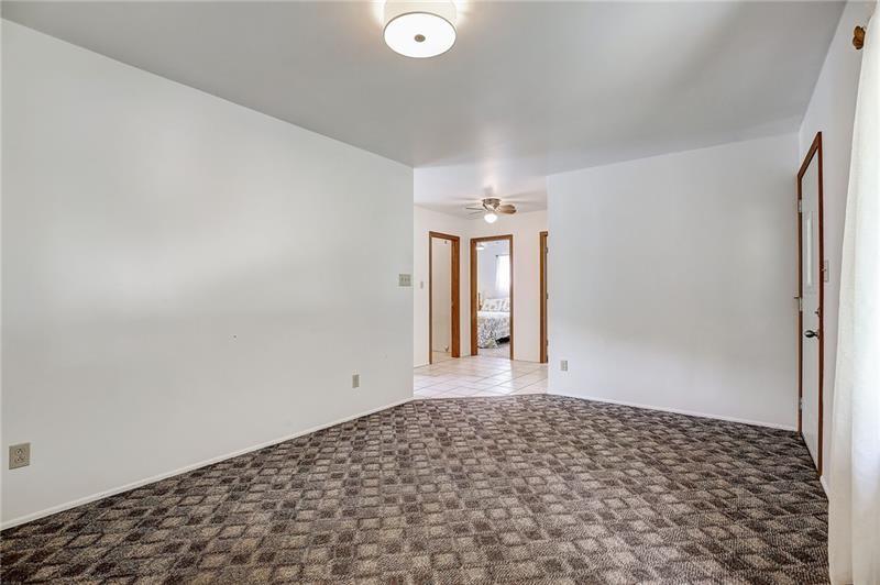 952 Seybertown Road East Brady, PA 16028 - Photo 3 of 46 a view of a big room with wooden floor and windows