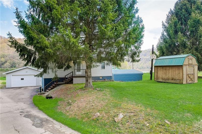 952 Seybertown Road East Brady, PA 16028 - Photo 31 of 46 a house with garden in front of it