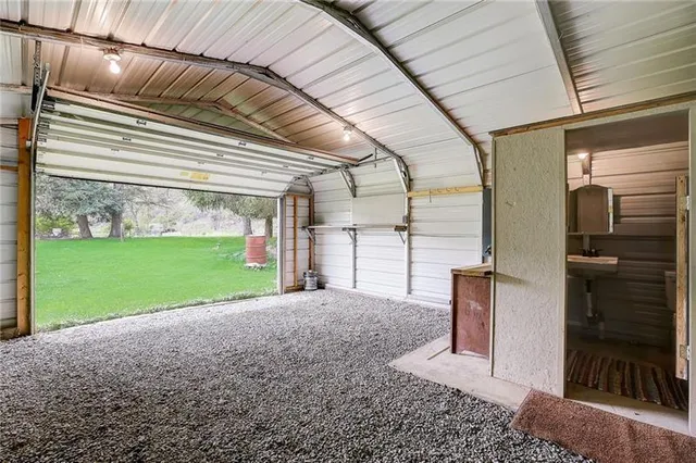 a view of a house with a yard and garage