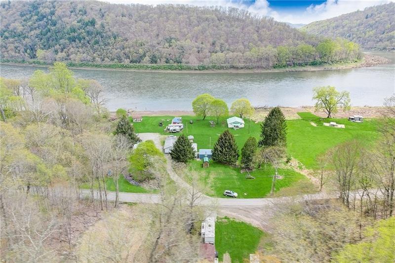 952 Seybertown Road East Brady, PA 16028 - Photo 42 of 46 a view of a lake with a mountain in the background