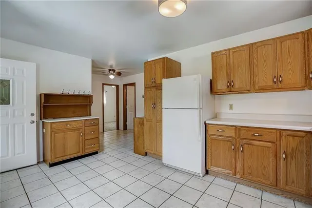 a kitchen with a refrigerator sink and microwave