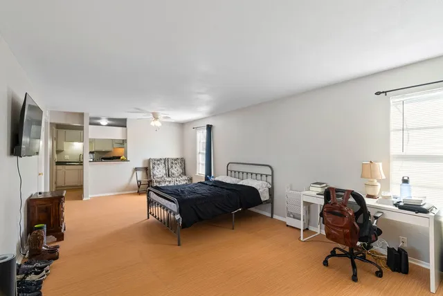 a bedroom with a workspace