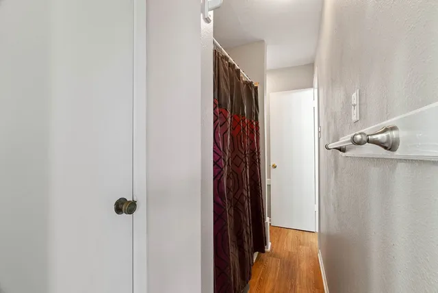 a bathroom with a granite countertop sink toilet and a mirror
