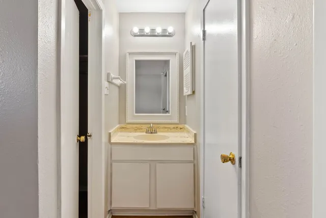 a white toilet sitting next to a shower curtain