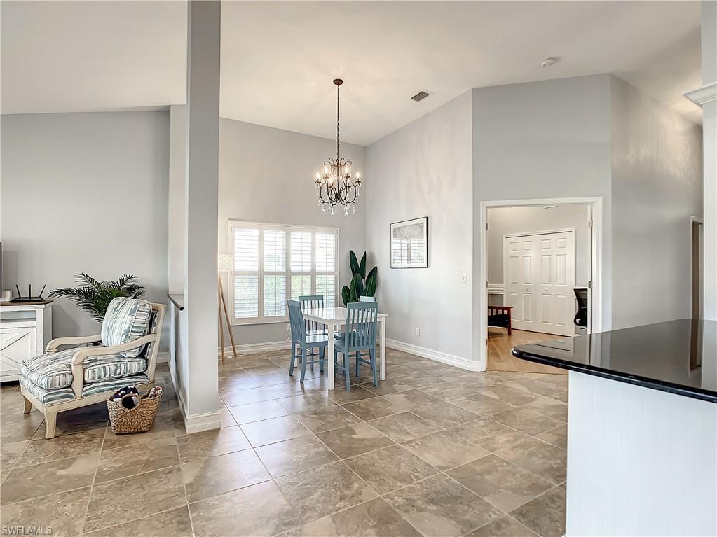 7858 Gardner Drive Naples, FL 34109 - Photo 18 of 35 a view of a livingroom with furniture and a window