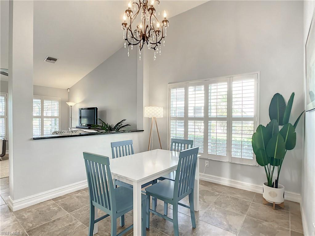 7858 Gardner Drive Naples, FL 34109 - Photo 19 of 35 a view of a dining room with furniture window and outside view