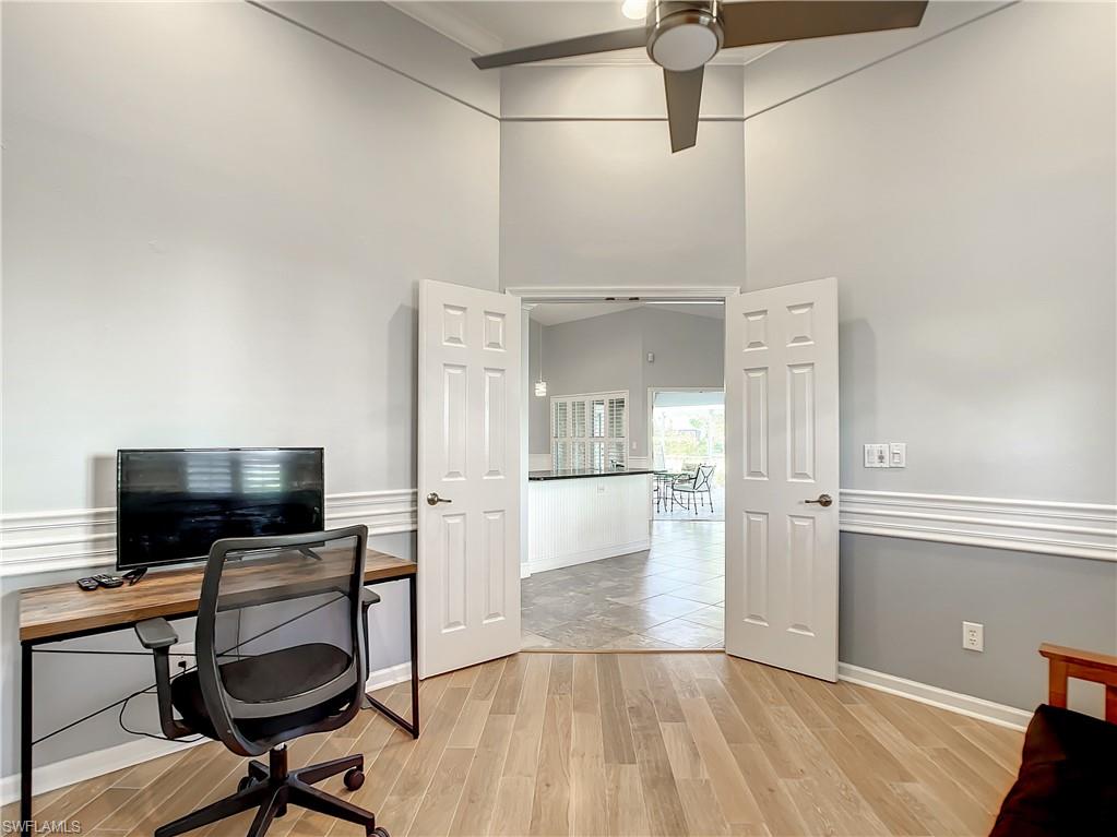 7858 Gardner Drive Naples, FL 34109 - Photo 20 of 35 a view of a livingroom with furniture and flat screen tv