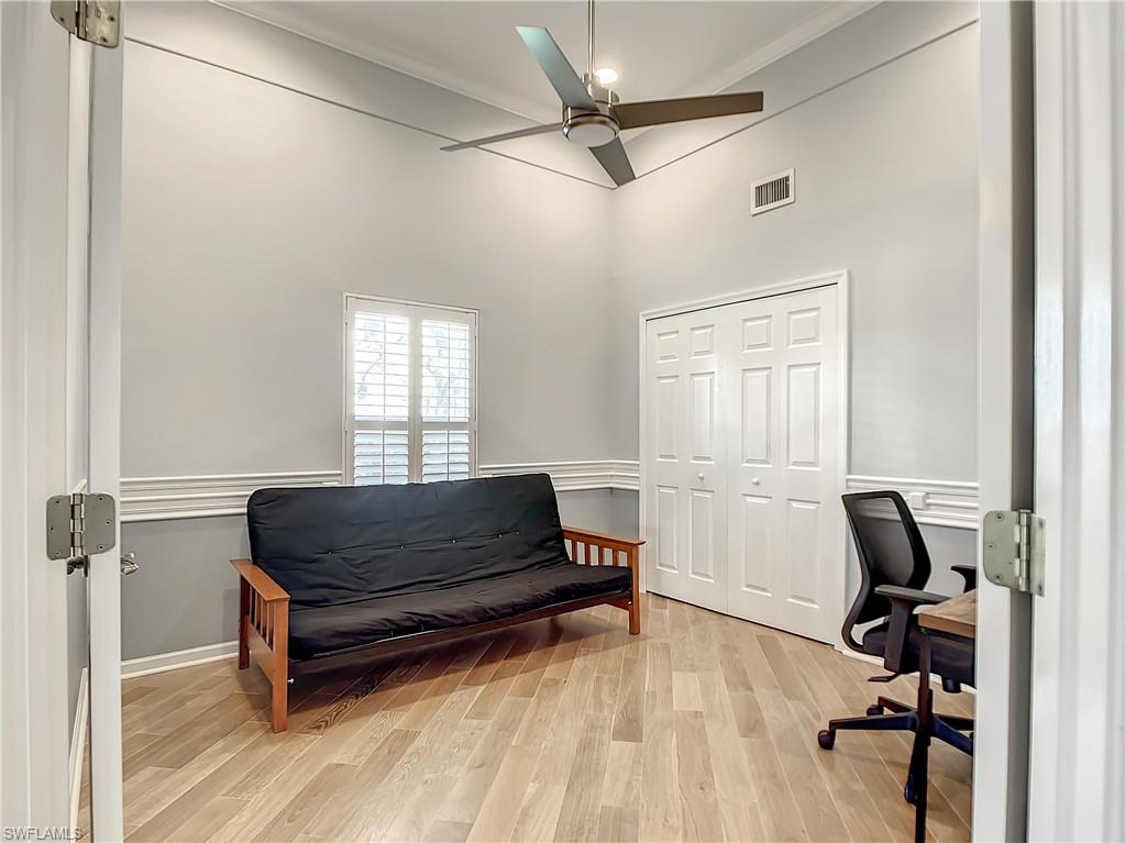 7858 Gardner Drive Naples, FL 34109 - Photo 21 of 35 a bedroom with a bed and a window