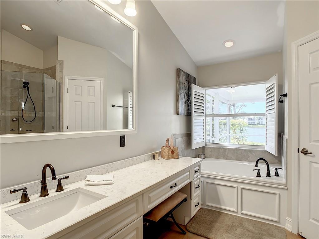 7858 Gardner Drive Naples, FL 34109 - Photo 25 of 35 a bathroom with a sink and a bathtub