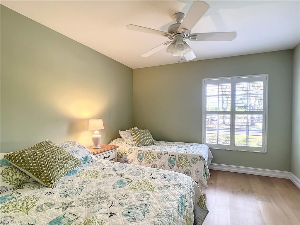 7858 Gardner Drive Naples, FL 34109 - Photo 30 of 35 a bedroom with a bed and a window
