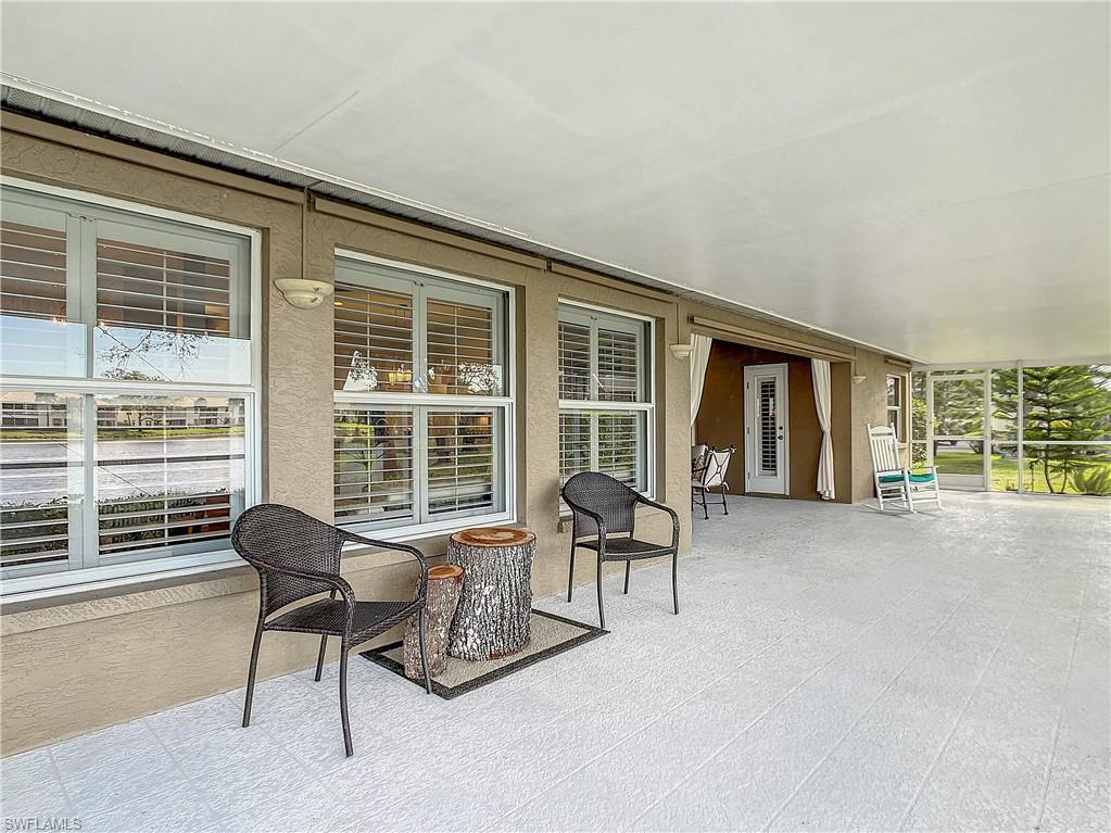 7858 Gardner Drive Naples, FL 34109 - Photo 35 of 35 a balcony with table and chairs