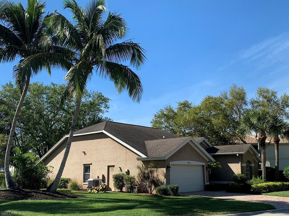 7858 Gardner Drive Naples, FL 34109 - Photo 7 of 35 a view of front of house with a yard