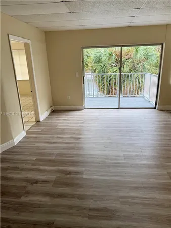 a view of an empty room with a window