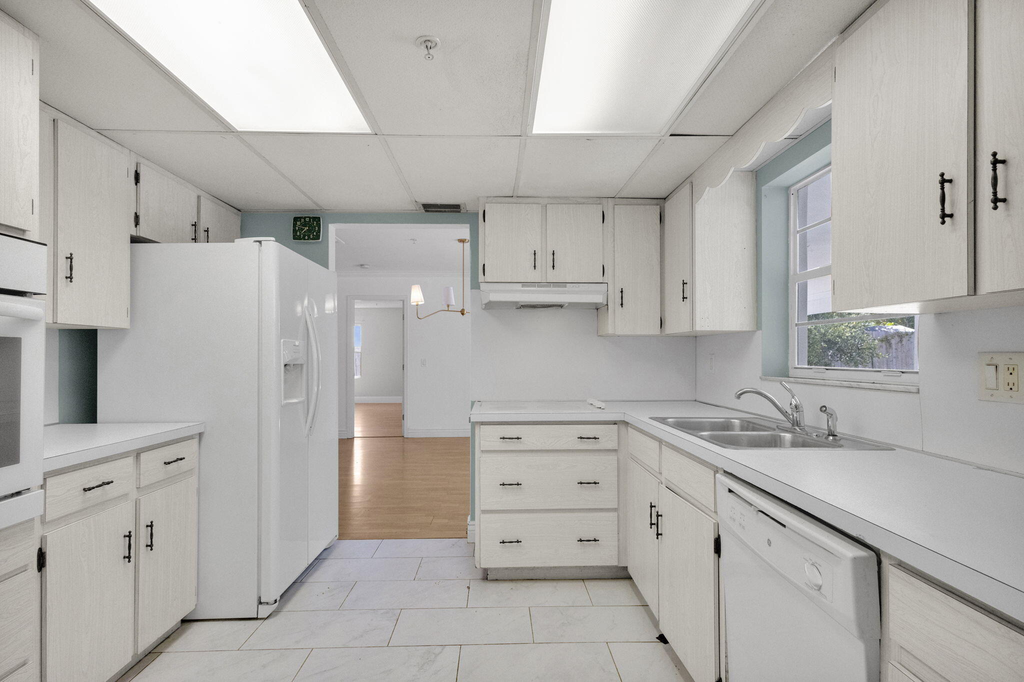 8888 Southeast Colony Street Hobe Sound, FL 33455 - Photo 14 of 69 a kitchen with cabinets appliances and a counter space