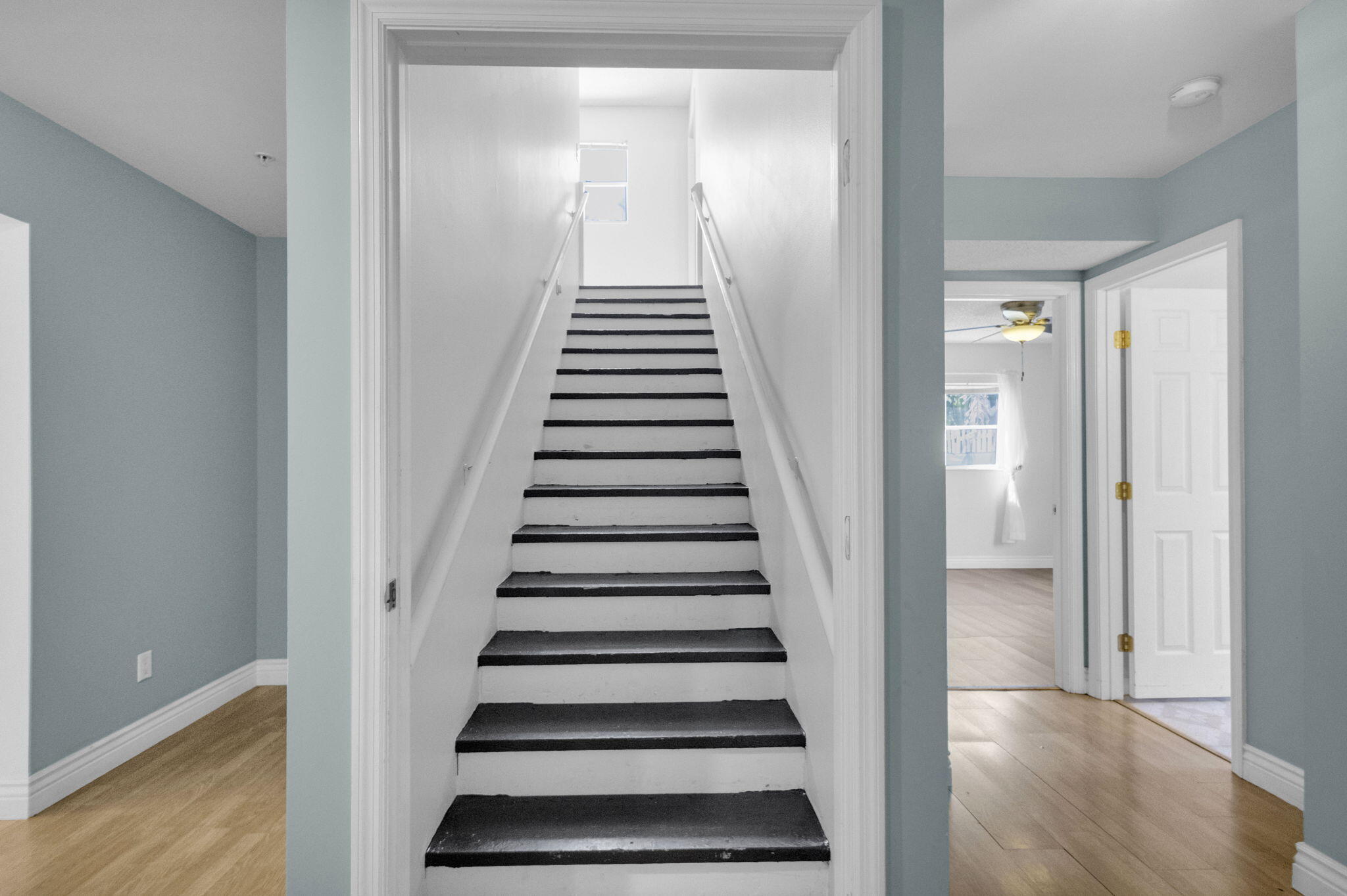 8888 Southeast Colony Street Hobe Sound, FL 33455 - Photo 19 of 69 a view of a hallway with wooden floor and entryway