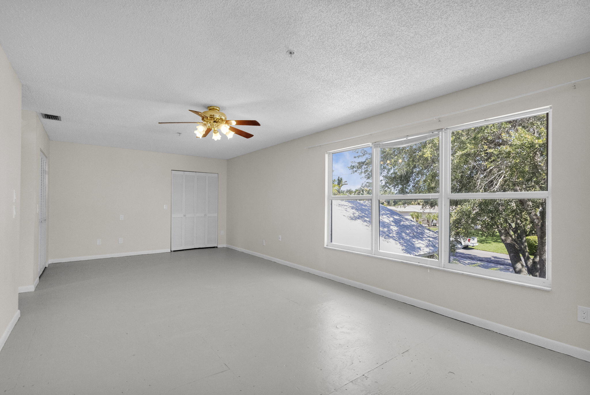 8888 Southeast Colony Street Hobe Sound, FL 33455 - Photo 40 of 69 wooden floor in an empty room with a window