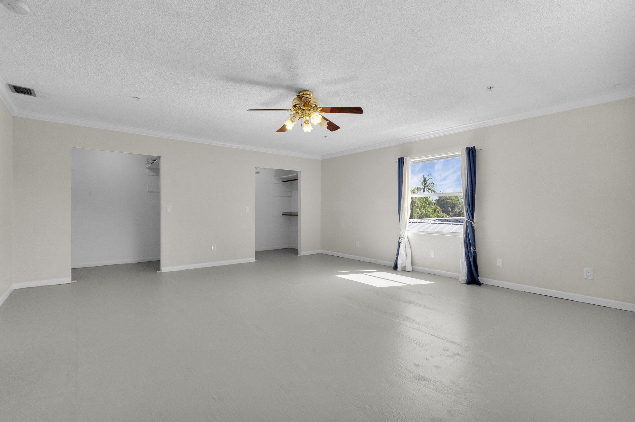 8888 Southeast Colony Street Hobe Sound, FL 33455 - Photo 43 of 69 a view of a livingroom with a furniture and a ceiling fan