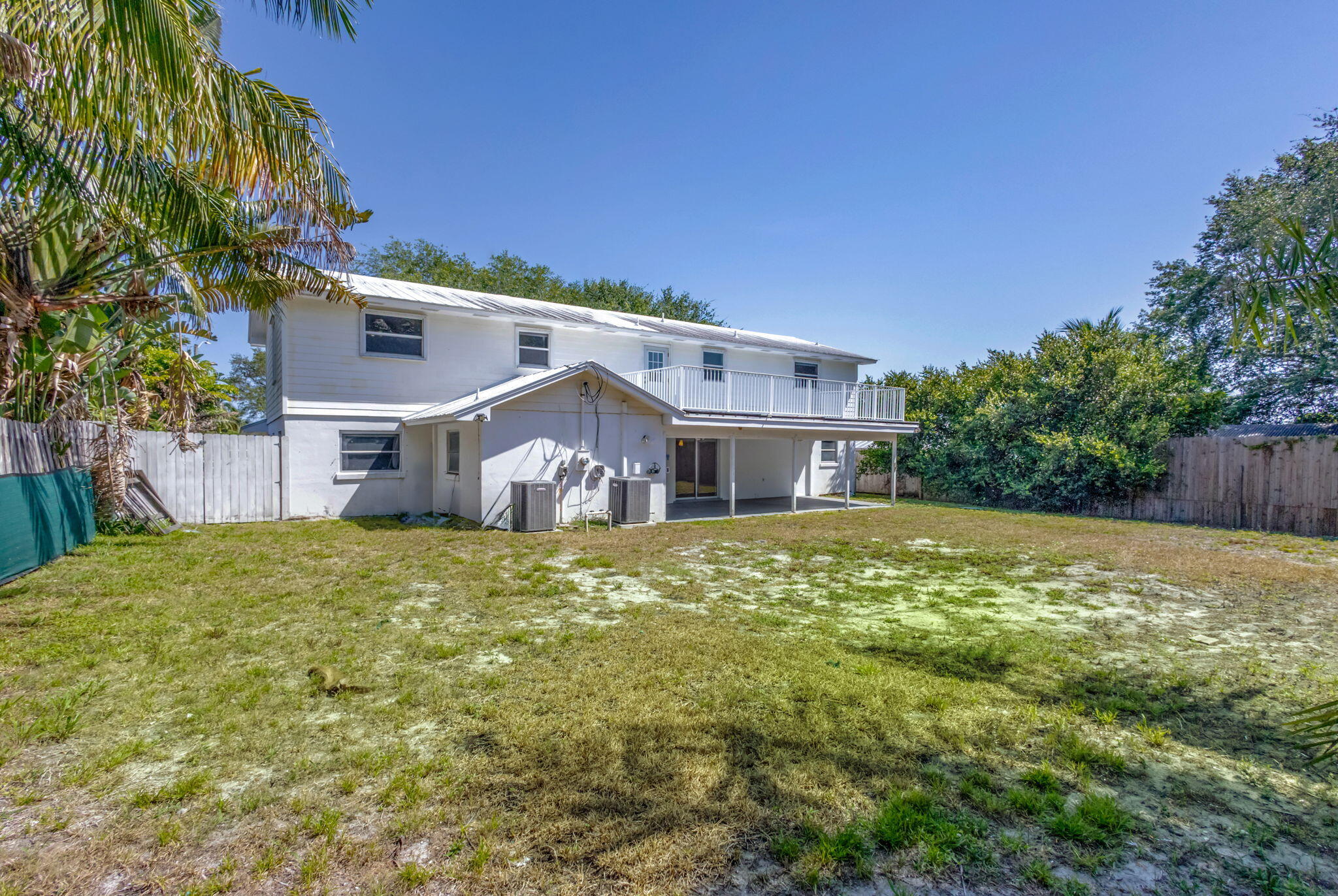 8888 Southeast Colony Street Hobe Sound, FL 33455 - Photo 53 of 69 a house view with a swimming pool