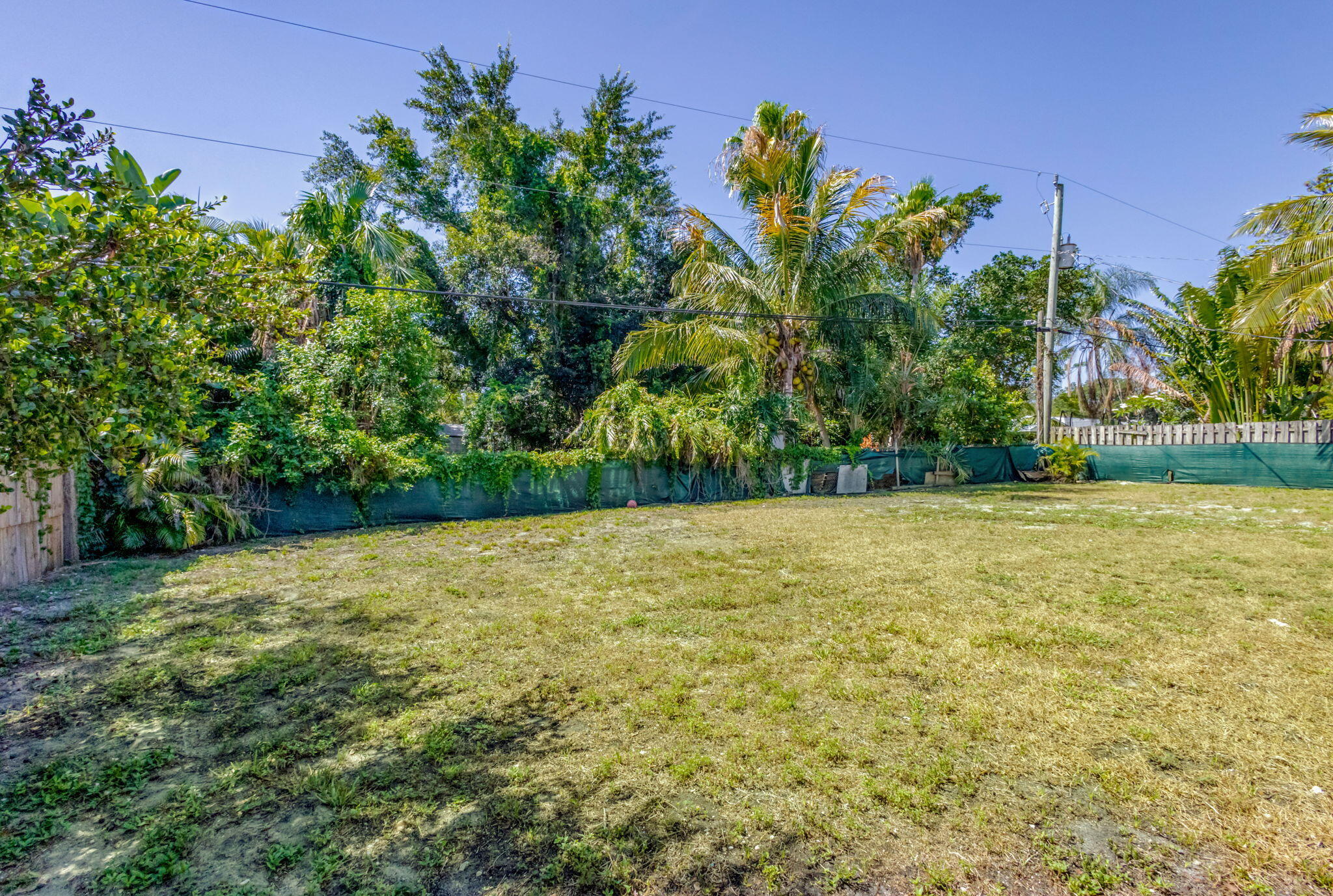 8888 Southeast Colony Street Hobe Sound, FL 33455 - Photo 56 of 69 a view of an outdoor space and a yard