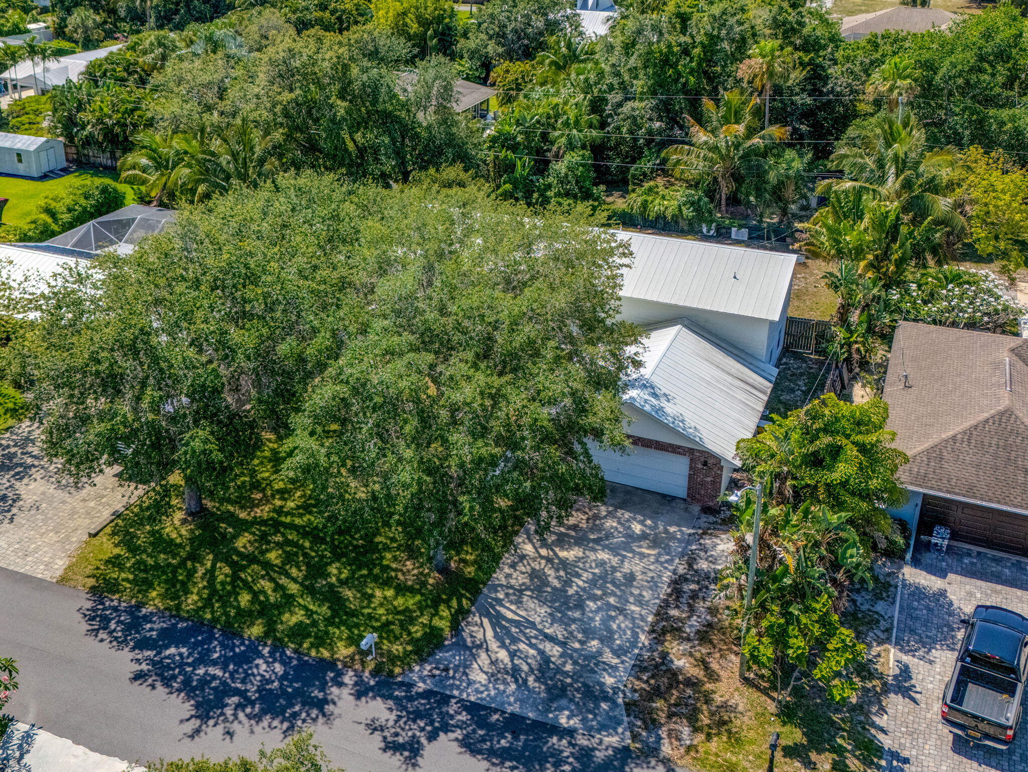 8888 Southeast Colony Street Hobe Sound, FL 33455 - Photo 59 of 69 an aerial view of a house with yard and outdoor seating