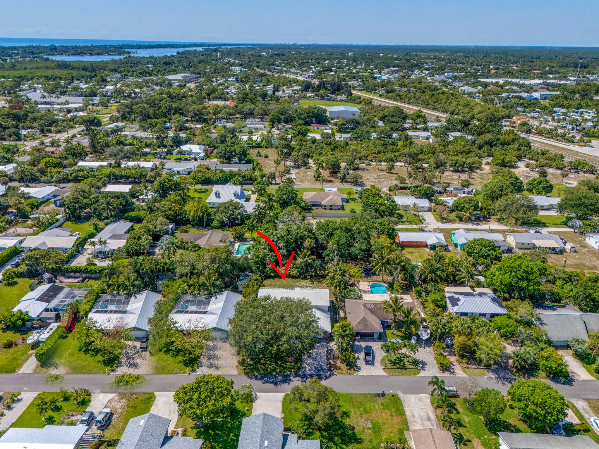 8888 Southeast Colony Street Hobe Sound, FL 33455 - Photo 65 of 69 an aerial view of a city with lots of residential buildings