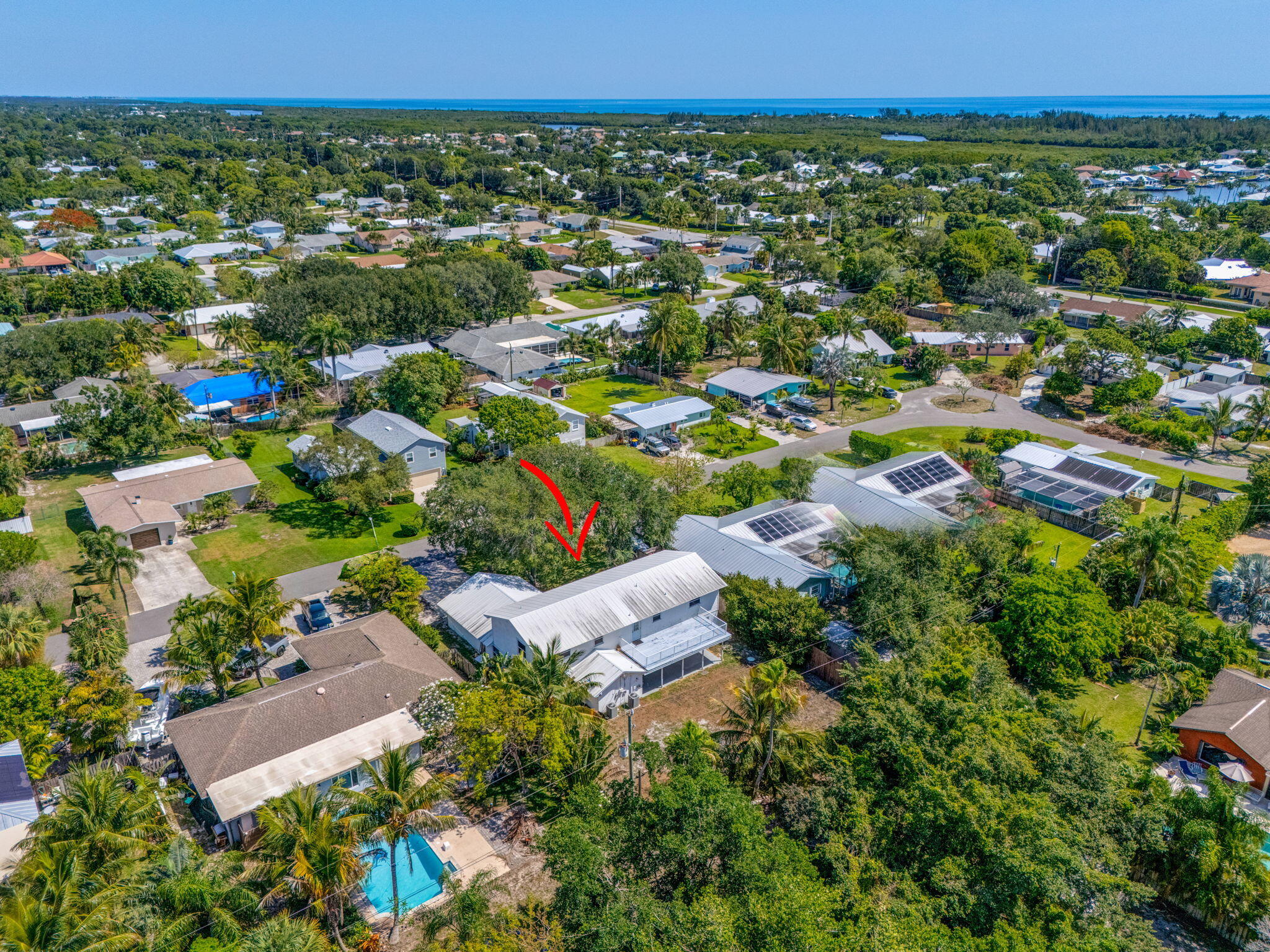 8888 Southeast Colony Street Hobe Sound, FL 33455 - Photo 68 of 69 an aerial view of residential house with outdoor space and trees all around