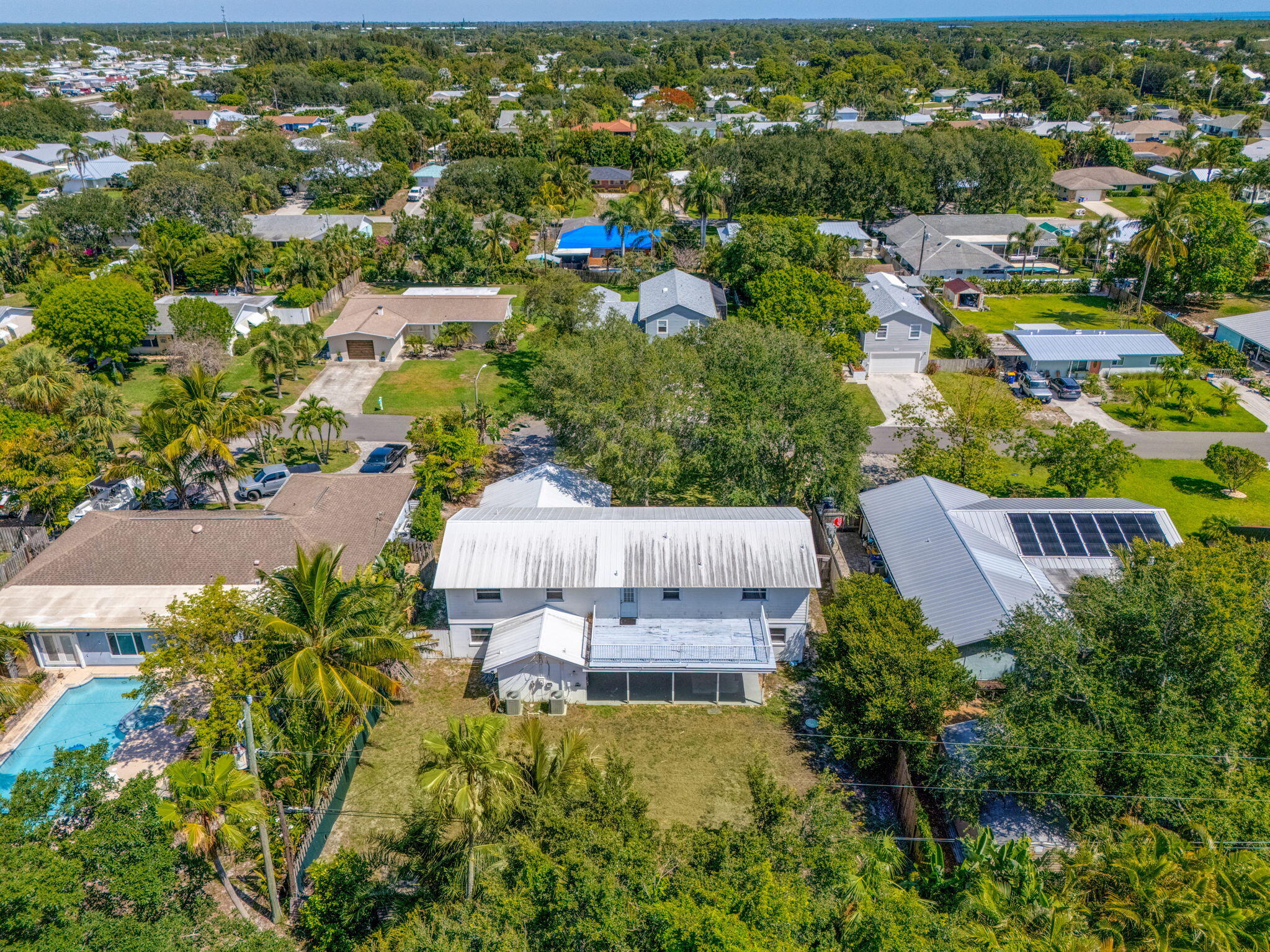 8888 Southeast Colony Street Hobe Sound, FL 33455 - Photo 69 of 69 an aerial view of a house with a garden
