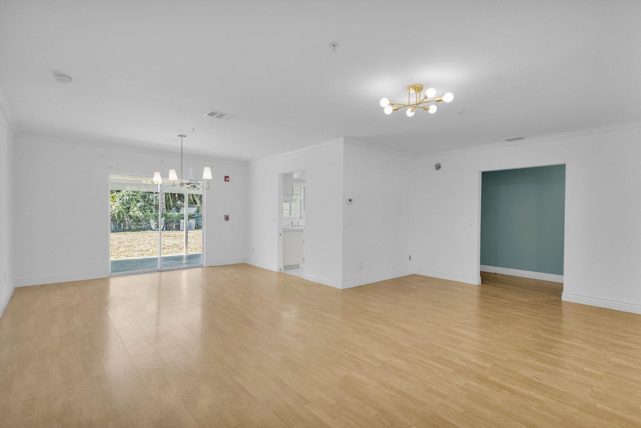 8888 Southeast Colony Street Hobe Sound, FL 33455 - Photo 9 of 69 wooden floor in an empty room with a window