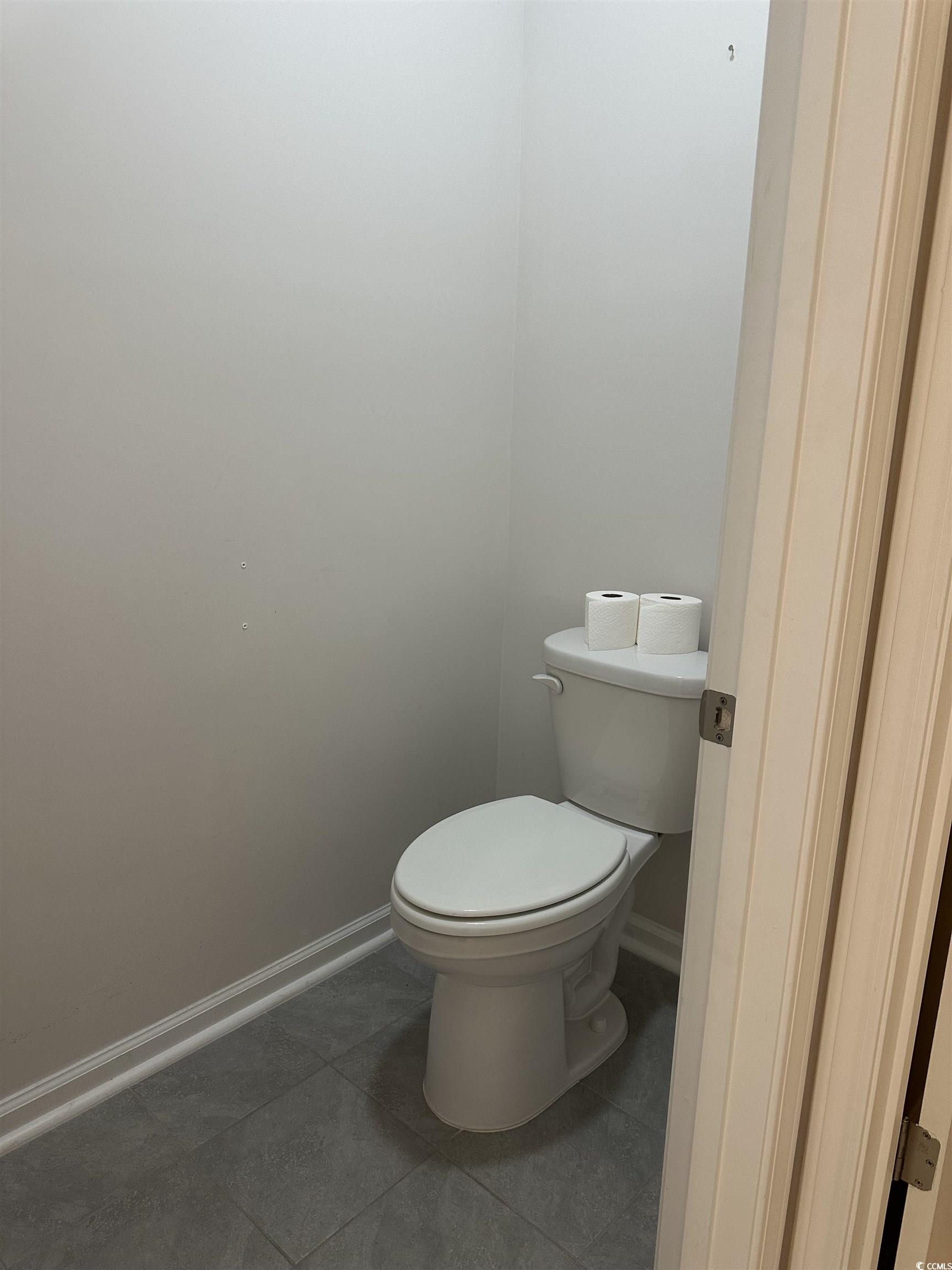 3789 Bells Lk Circle Longs, SC 29568 - Photo 15 of 26 Bathroom featuring toilet and dark tile patterned flooring