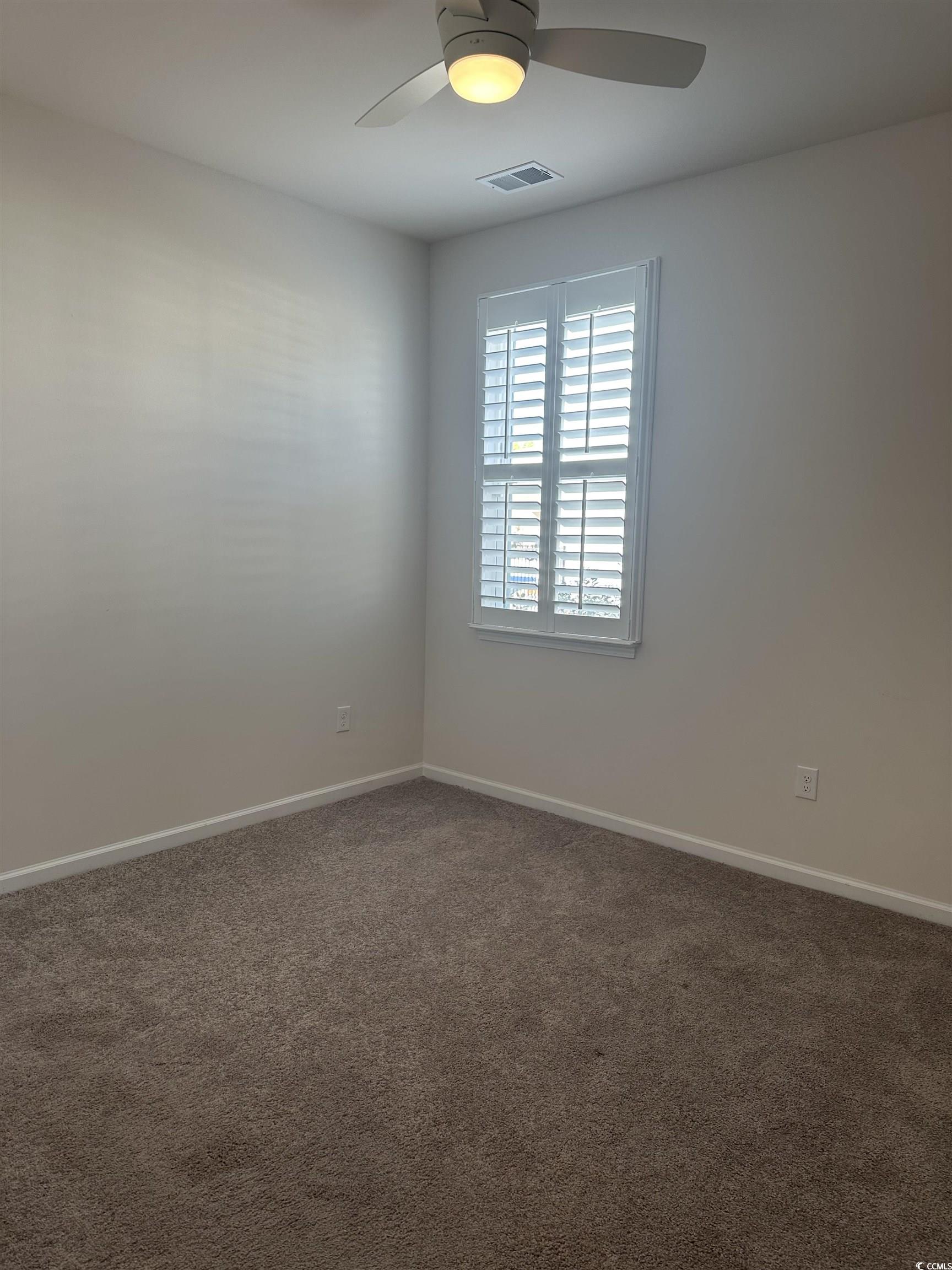 3789 Bells Lk Circle Longs, SC 29568 - Photo 16 of 26 Carpeted empty room with baseboards and a ceiling fan