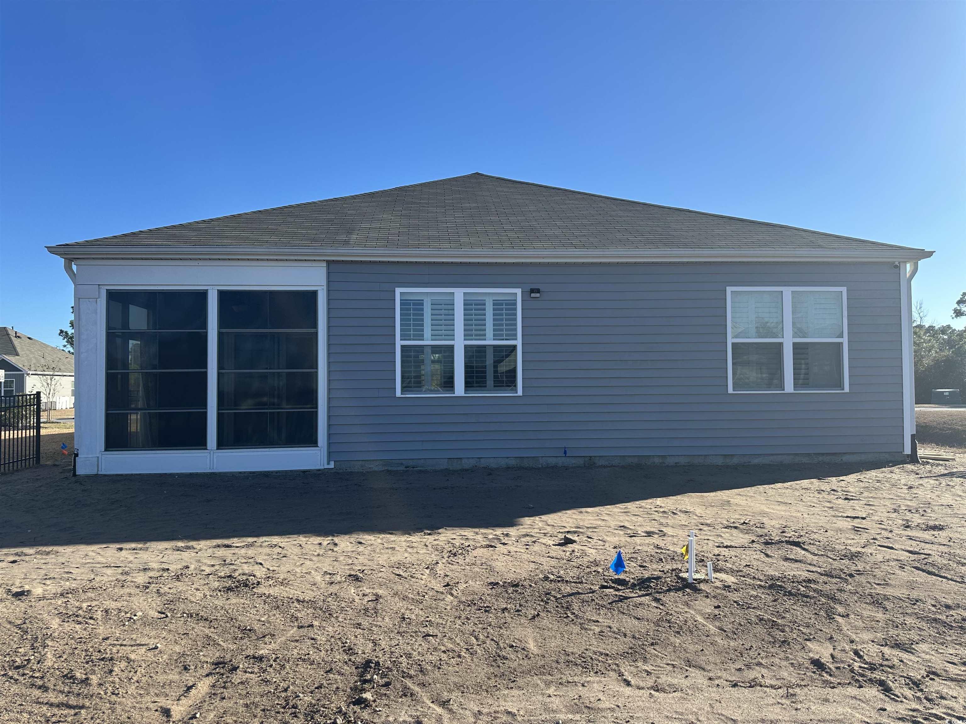 3789 Bells Lk Circle Longs, SC 29568 - Photo 25 of 26 Rear view of house featuring roof with shingles