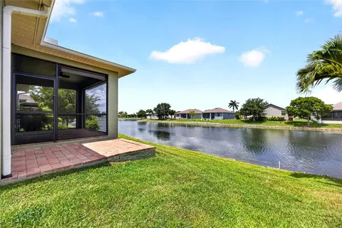 a view of a backyard with a lake view