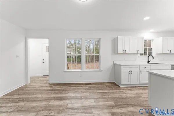 a view of a kitchen with a sink cabinets and a window