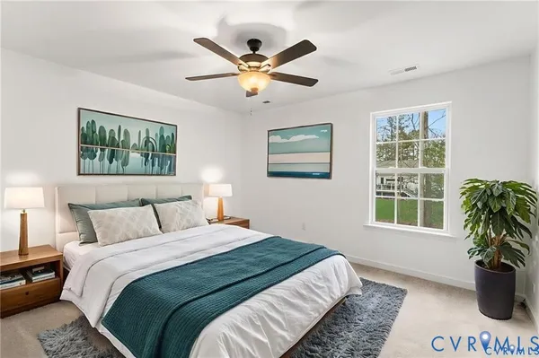 a bedroom with a large bed and a window