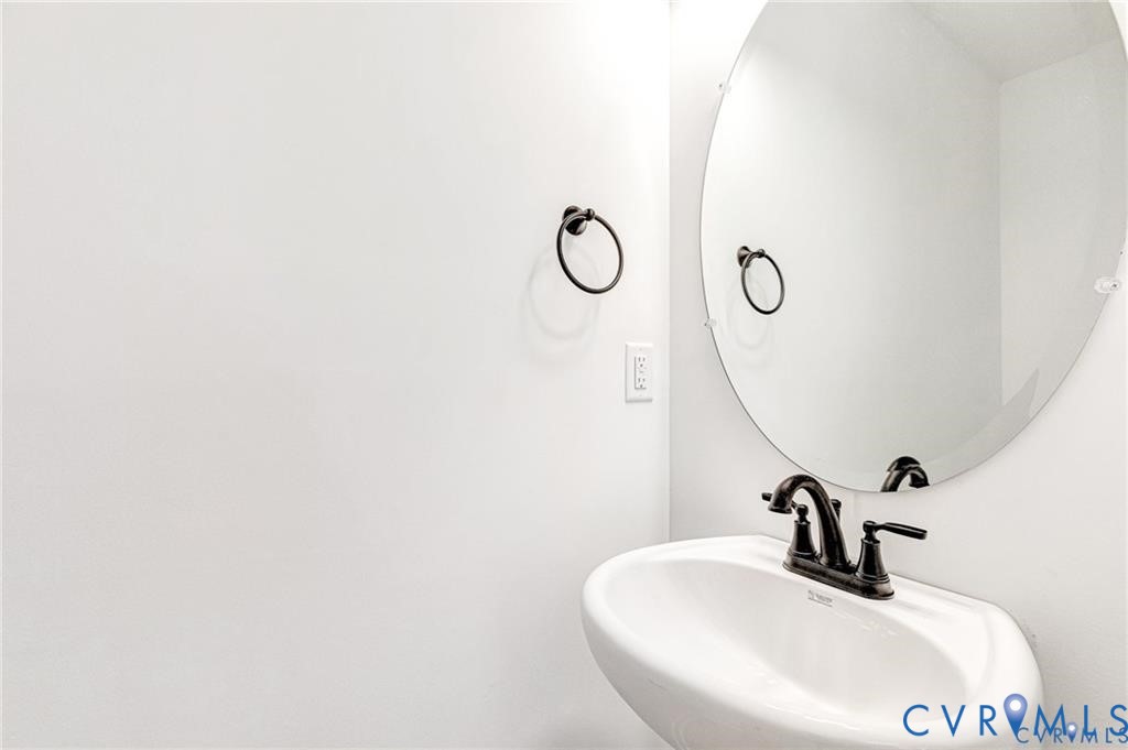 512 Freedom Drive Ruther Glen, VA 22546 - Photo 21 of 36 a bathroom with a sink and mirror