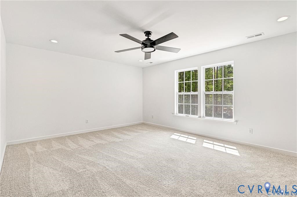 512 Freedom Drive Ruther Glen, VA 22546 - Photo 22 of 36 an empty room with windows and fan
