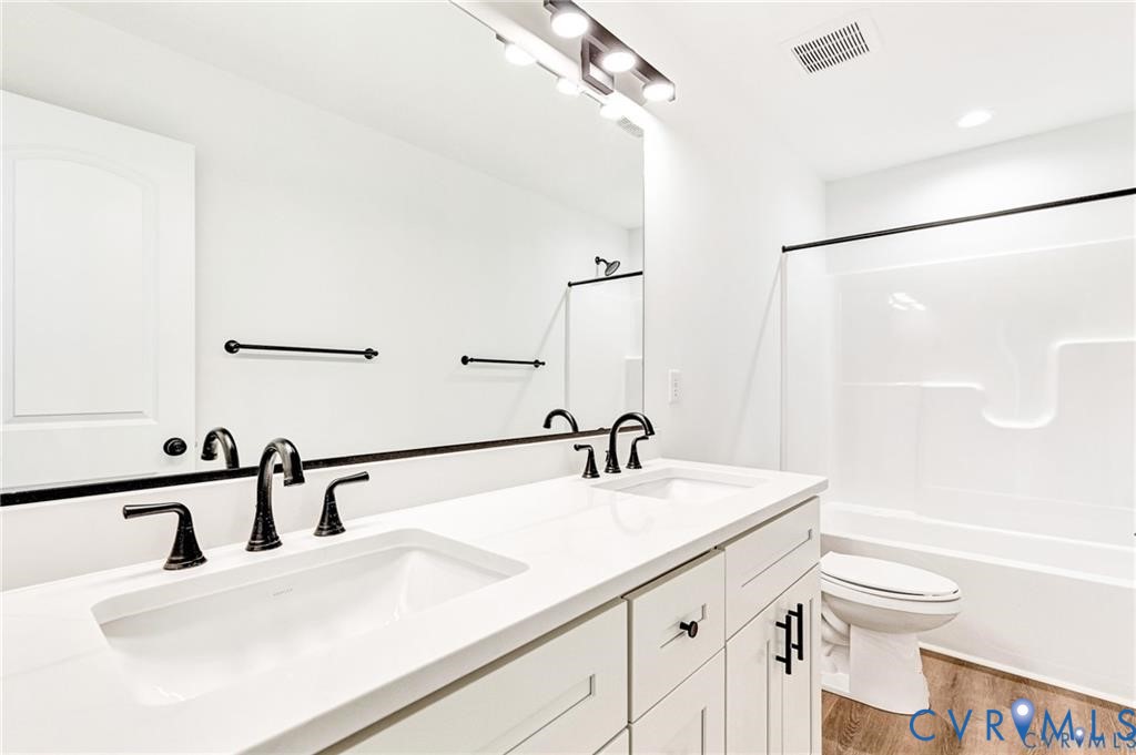 512 Freedom Drive Ruther Glen, VA 22546 - Photo 35 of 36 a bathroom with a sink and a mirror