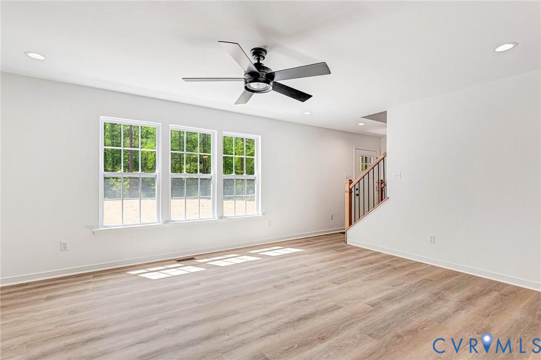 512 Freedom Drive Ruther Glen, VA 22546 - Photo 4 of 36 a view of empty room with wooden floor and fan
