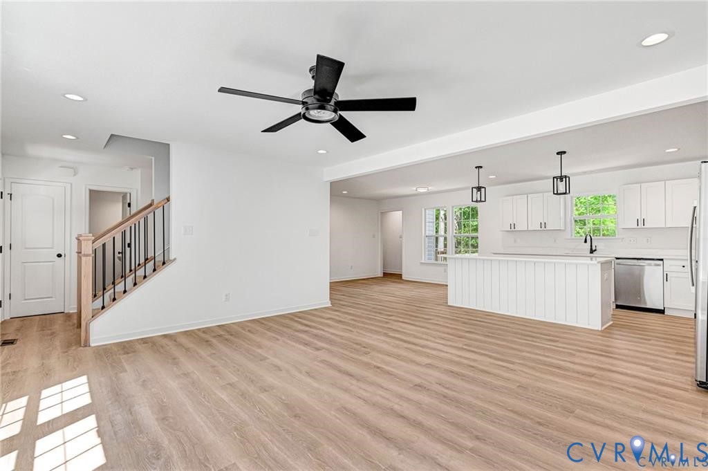 512 Freedom Drive Ruther Glen, VA 22546 - Photo 5 of 36 a view of an empty room with wooden floor and a window