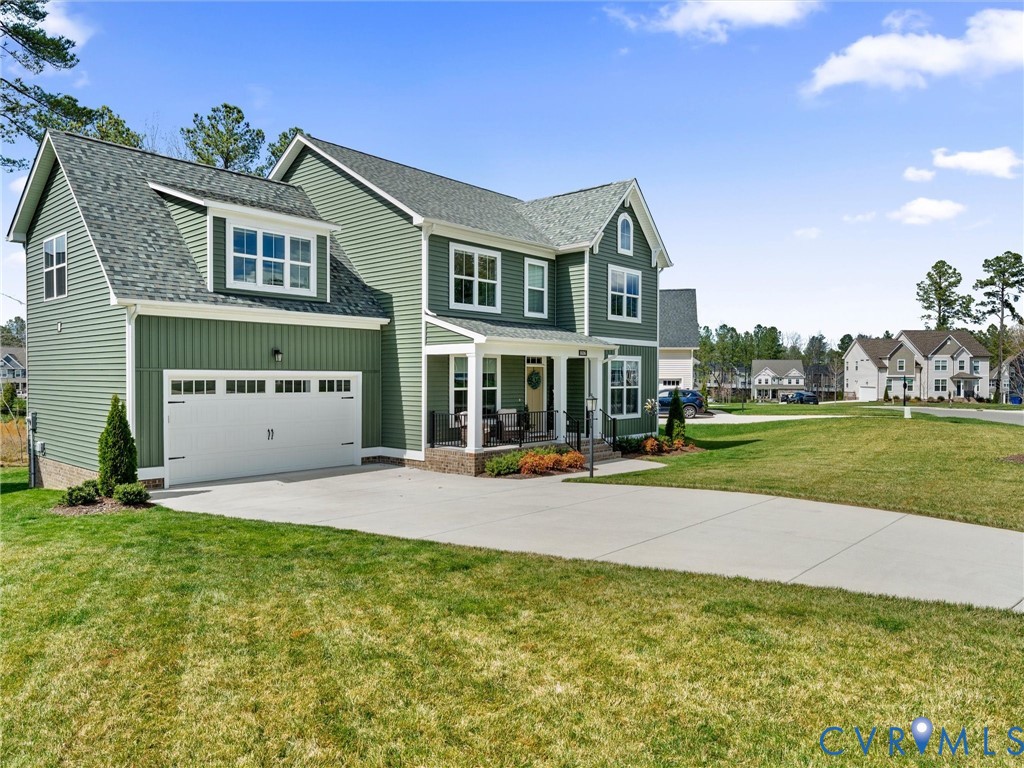 16106 Cambian Lane Chesterfield, VA 23832 - Photo 2 of 50 a front view of a house with a yard and garage