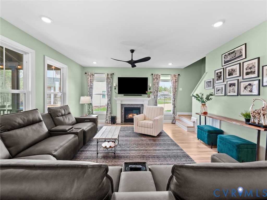 16106 Cambian Lane Chesterfield, VA 23832 - Photo 24 of 50 a living room with furniture and a flat screen tv